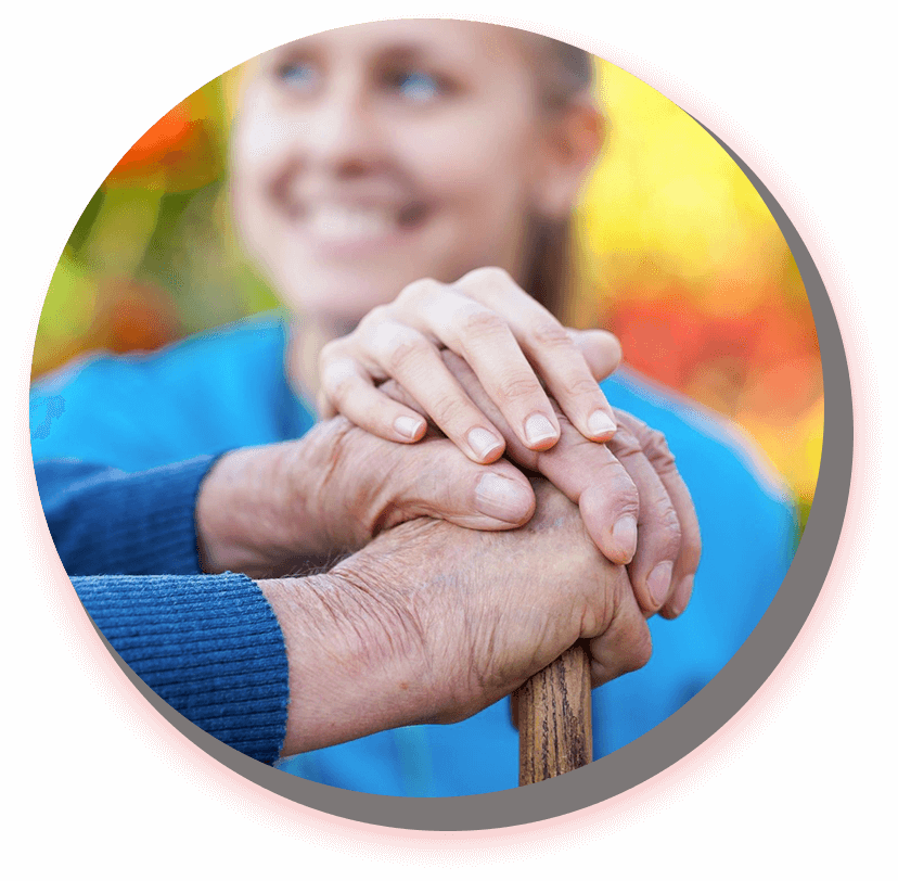 A person holding their hands on top of a cane.